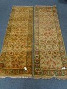 Two Raja design beige ground runners, floral field, repeating border,