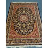 Kashan style blue ground rug, central medallion,