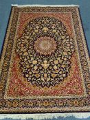Kashan style blue ground rug, central medallion,