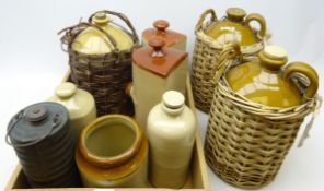 Three flagons, all with woven wicker baskets, three stoneware hot bottles,