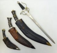 Three 20th century graduated Indian Kukri knives, one stamped Indian Handicraft,
