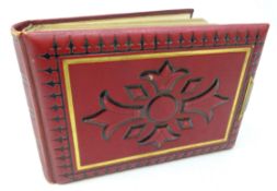 Victorian gilt tooled red leather photograph album containing sepia cabinet portraits of family