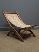 19th century teak folding campaign chair, metal fittings, slung striped fabric seat,