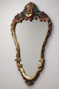 Ornate gilt and painted floral framed wall mirror,