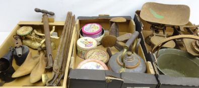 Two cast iron scales and a set of kitchen scales, two brass jam pans, copper kettle, shoe lasts,