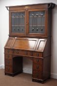 Edwardian oak bureau bookcase, two lead glazed doors enclosing shelves,