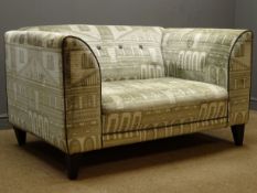 DFS snuggle chair, upholstered fabric with architectural pattern, W136cm,