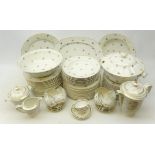 Limoges dinner service decorated with floral sprigs on plain ground comprising twenty-three dinner