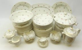 Limoges dinner service decorated with floral sprigs on plain ground comprising twenty-three dinner