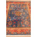 Large Chinese blue ground rug carpet, central dragon medallion, floral field, repeating border,