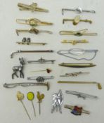 Collection of tie clips and pins including; golfing, Royalty, horse racing, animals, clovers,