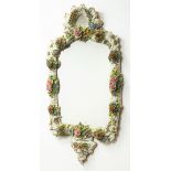 Sitzendorf porcelain floral encrusted wall mirror with scroll moulded frame and cresting, H83cm,