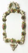 Sitzendorf porcelain floral encrusted wall mirror with scroll moulded frame and cresting, H83cm,