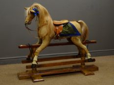 19th century tan and white pony skin covered rocking horse, bridle, saddle and stirrups,