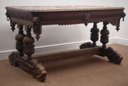Large Victorian carved oak stretcher table, canted rectangular top carved with lunettes,