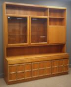 G-Plan teak wall unit, two glazed doors enclosing fitted shelves, fall front section,