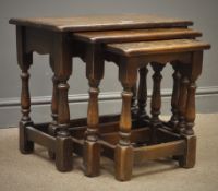 Early 20th century solid oak nest of three joint tables, turned supports with stretchers, W56cm,