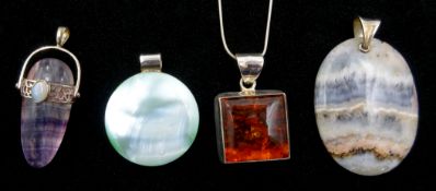 Silver amber pendant necklace and three other stone set pendants (4) Condition Report