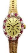 Ladies Swiss 9ct gold wristwatch, diamond and ruby bezel,