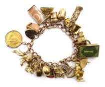 9ct gold bracelet with 24 charms, hallmarked 9ct and a 1900 half sovereign loose mounted, approx 63.