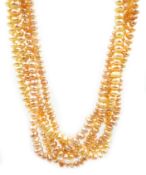 Five strand peach coloured rice pearl necklace, with 9ct gold clap,
