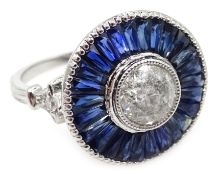 Platinum (tested) diamond and calibre cut sapphire circular ring,