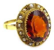Gold oval orange garnet and seed pearl ring, stamped 9ct Condition Report Approx 5.