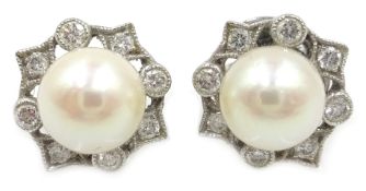 Pair of 18ct white gold pearl and diamond rim set ear-rings stamped 750 Condition Report