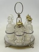 Late Victorian silver-plated six bottle cruet with five etched and hobnail cut bottles, one matched,