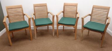Set four teak garden armchairs with seat cushions,
