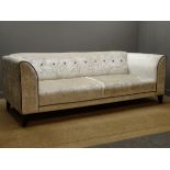 Four seat DFS sofa upholstered in cream fabric with dark grey trim (W227cm),