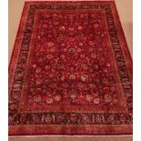 Fine quality Persian Meshed carpet, floral design on red ground field, repeating border,