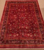 Fine quality Persian Meshed carpet, floral design on red ground field, repeating border,