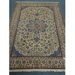 Fine Nain beige and blue ground rug, central medallion on floral field, repeating border,