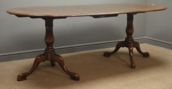 20th century oak oval twin pedestal extending dining table with additional leaf,