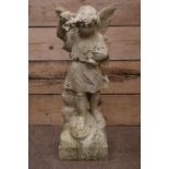 Weather marble figured of a winged angel with floral decoration,