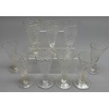 Nine early 19th century matched set of wine glasses with spiral twist conical bowls on knopped