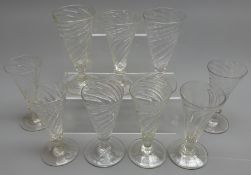 Nine early 19th century matched set of wine glasses with spiral twist conical bowls on knopped