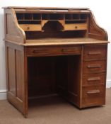 Early 20th century oak single pedestal tambour roll top desk, enclosing fitted interior,