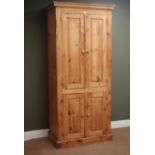 Traditional pine cupboard, projecting cornice, four cupboard doors, enclosing shelves, plinth base,