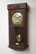 Early 20th century carved oak cased wall clock, circular Arabic dial,