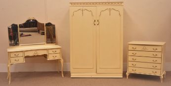 Mid to late 20th century French style cream and gilt bedroom suite consisting of a wardrobe with