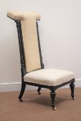 Late Victorian ebonised prie-dieu chair, carved and gilt decoration,