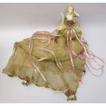 Pincushion style doll by Wayne Kleski, clothed in a long dress with ribbon and rose embellishments,