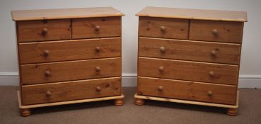 Pair pine chests, two short and three long drawers on bun feet, W82cm, H75cm,