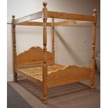 Solid waxed pine 5' kingsize four poster bed, shaped and moulded head and footboard,