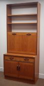 G-Plan teak cocktail wall unit, two shelves, above fall front, single drawer, two cupboard doors,