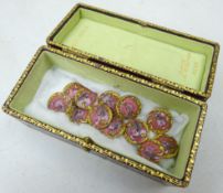 Set of twelve early 20th century French gilt & enamelled buttons stamped E.