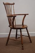 Early 20th century beech stick back armchair, shaped cresting rail,