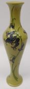 Moorcroft vase decorated in the 'Bluebell Harmony' pattern on green ground,